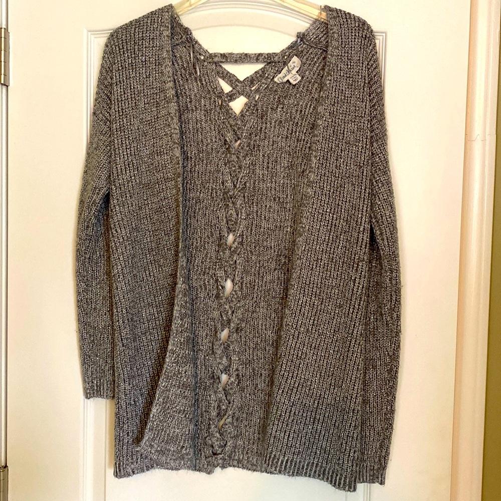 Very soft with shimmer sweater.  Braided material down the back